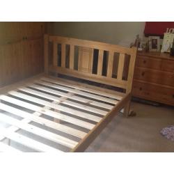 Small double bed and mattress.