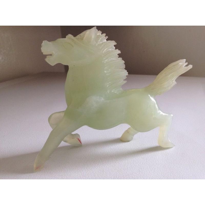 Jade sculpture of a running horse